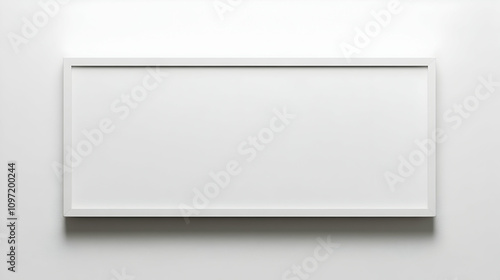 A minimalist white rectangular frame on a white wall, providing blank space for text or image.