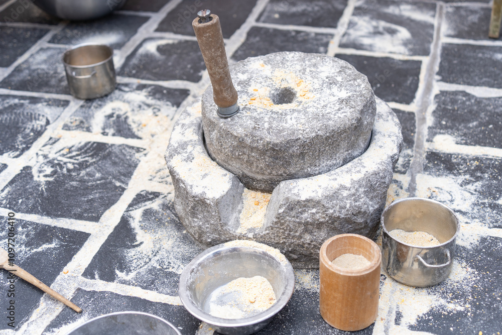 Traditional ancient stone mill for grinding grain Traditional ancient stone mill for grinding grain