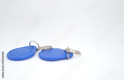 2 blue RFID (Radio Frequency Identification) keychain receivers on white background. Used by electronics, mechatronics, and networking engineers. photo