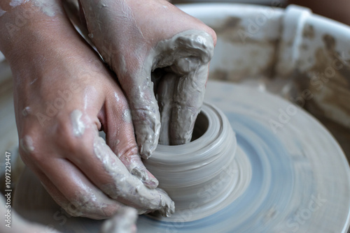 Making of mud pot on potters wheel during workshop in art ceramic atelier in Poland