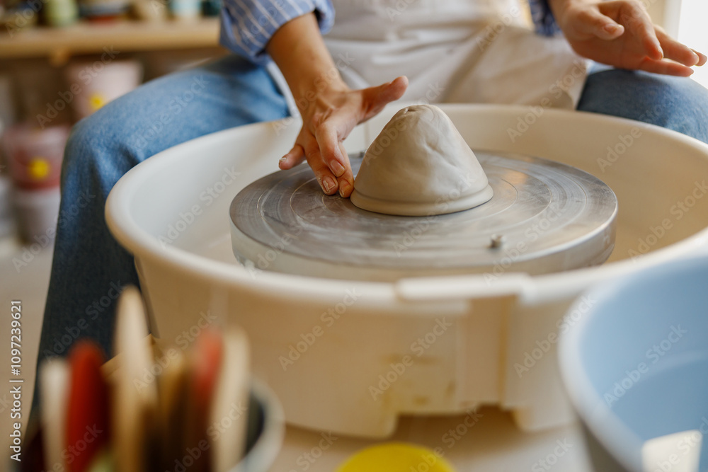 Fototapeta premium Artisan Pottery The Art of Creating Unique Forms on the Wheel in a Creative Environment