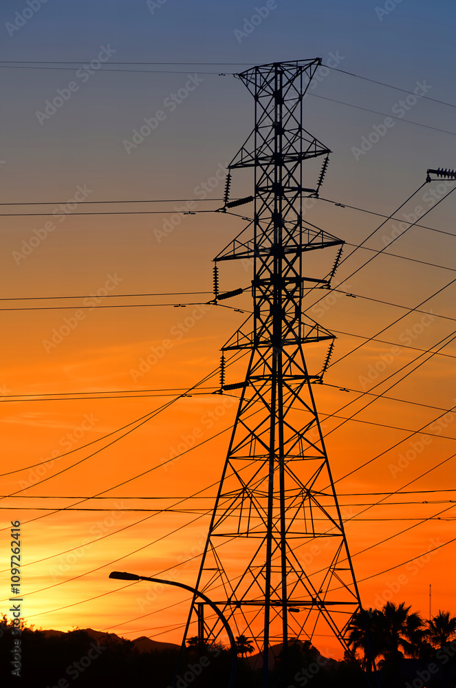 Fototapeta premium High electric pylon and pole in sunset
