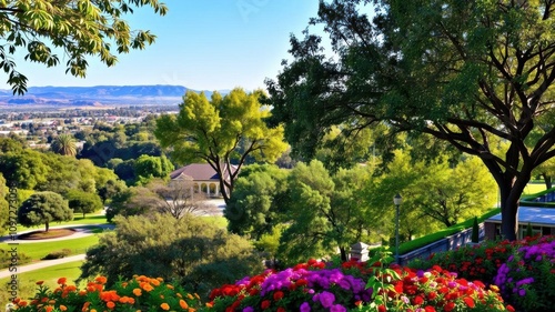 Lush green city park with colorful flowers and trees, serene, green