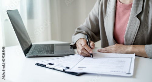 Executive CEO businesswoman checking job applicant documents resumes, interviews, and signing to approve the contract in the office room