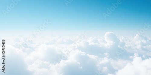 Delicate wisps of cloud-like shapes drifting through a vast light blue expanse, ethereal, airy, feathery