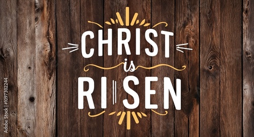 christ is risen lettering on card with wooden background