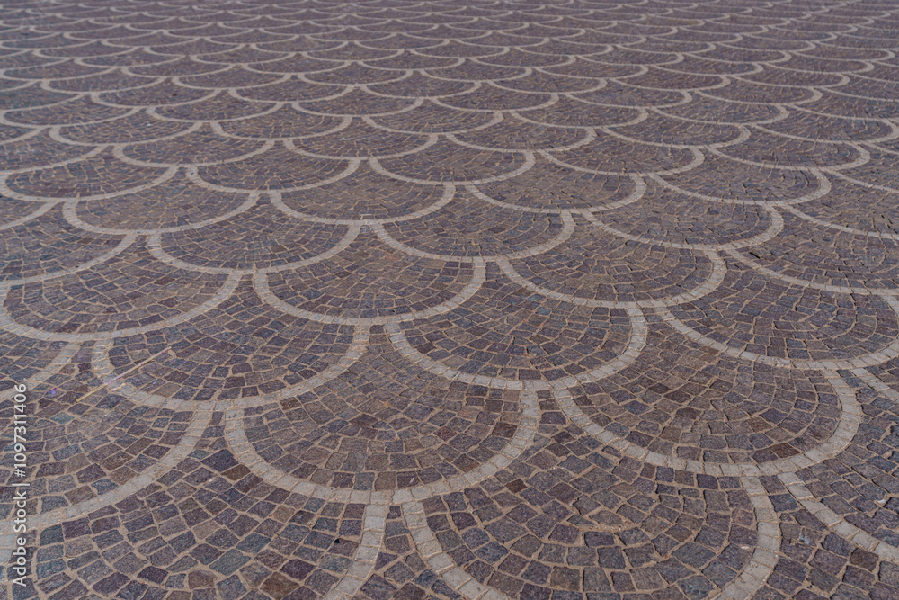 Beautifully and symmetrically arranged paving stones on a large square Beautifully and symmetrically arranged paving stones on a large square