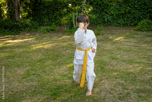 Kid practicing Taekwondo in the park