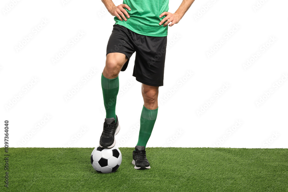 Football player with soccer ball on artificial grass against white background, closeup Football player with soccer ball on artificial grass against white background, closeup