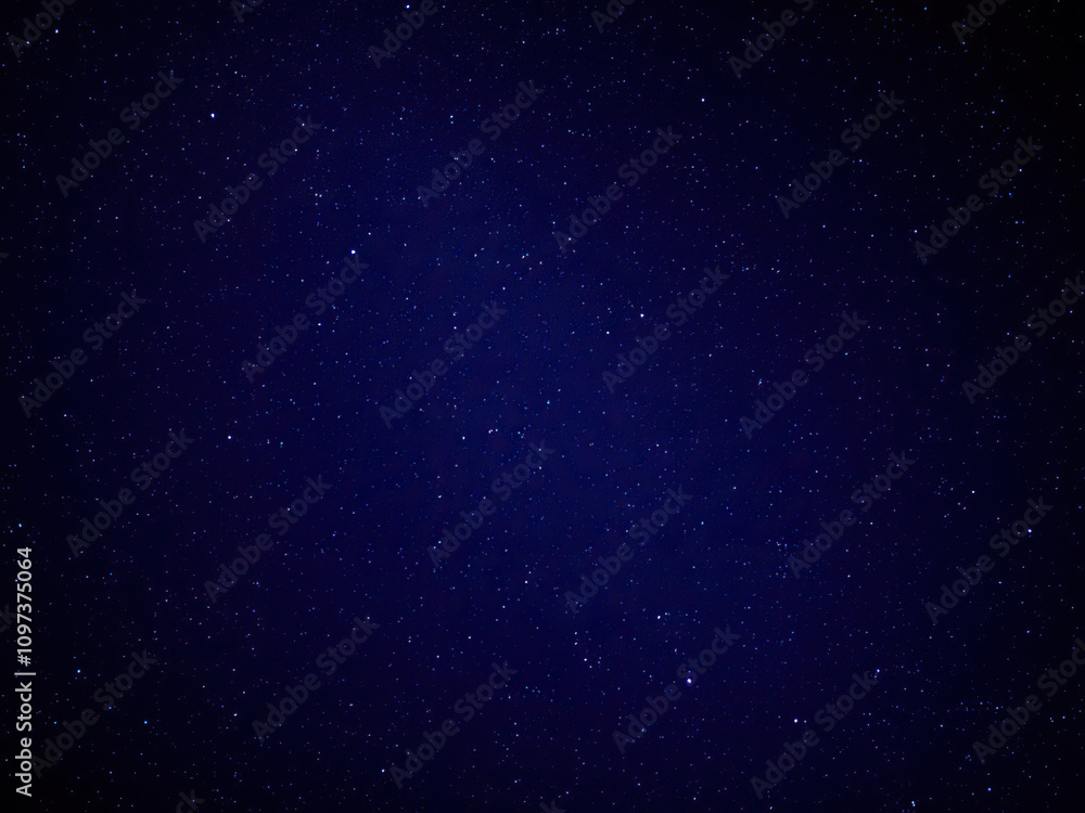 Obraz premium Deep blue night sky with twinkling stars on a black background, stars, space