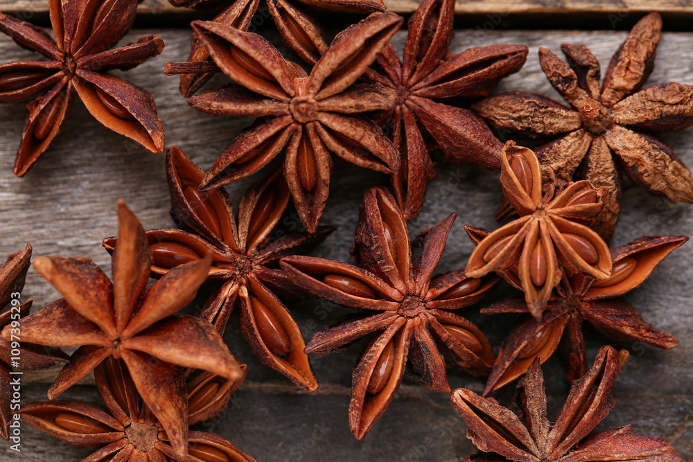 Aromatic star anise spice on wooden table, closeup Aromatic star anise spice on wooden table, closeup