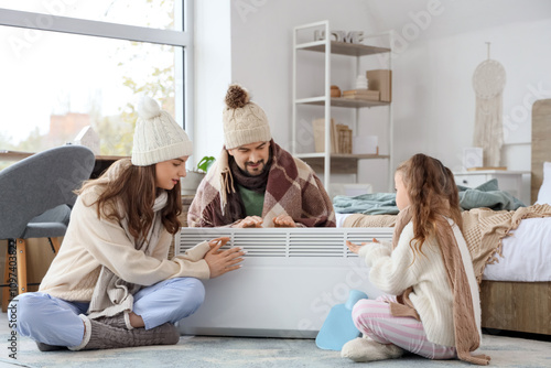 Frozen family warming near ...