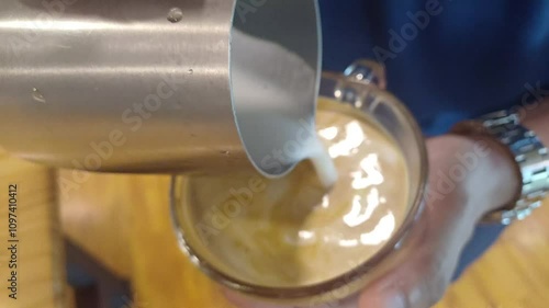 Latte art failure over a freshly brewed espresso coffee. Failure of latte art. Bad cappuccino coffee. 