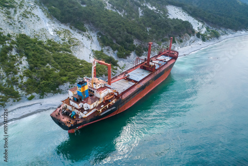 Aerial view of an abandoned bulk-carrier dry cargo ship washed ashore after a storm photo