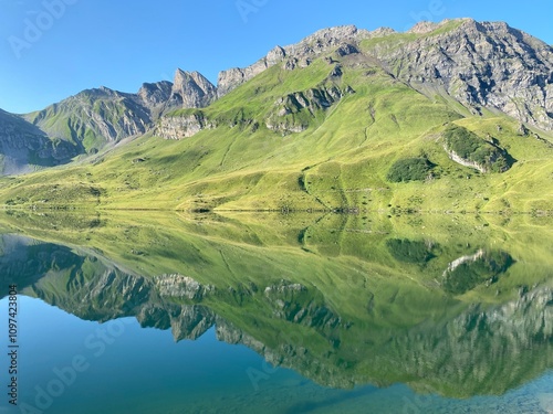 The alpine lake Melchsee or Melch Lake in the Uri Alps mountain massif, Kerns - Canton of Obwald, Switzerland (Kanton Obwalden, Schweiz) photo