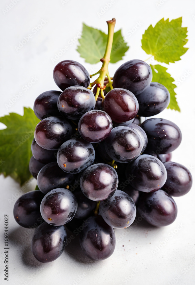 Fototapeta premium Fresh Bunch of Black Grapes Isolated on a White Background.