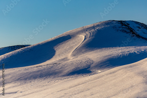 Gamla Uppsala, Sweden: The snow-covered Royal Mounds date back to the Viking Age's Vendel period (550 – 800 AD). photo