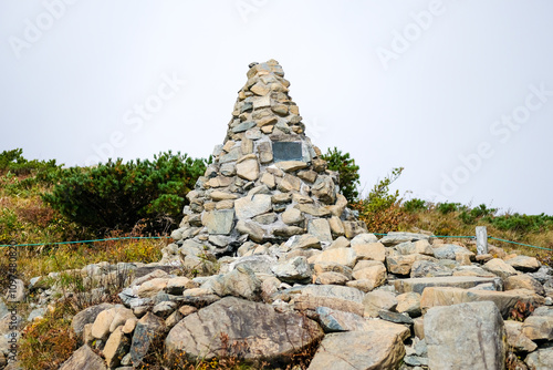 Happo Alpen Line Nature trail, Hakuba, Nahano, Japan, Stone monument on a hillside. text translate 