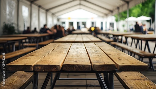 Wallpaper Mural Wooden beer tables in an outdoor covered area, shot from the front perspective. A large wooden table with long wood benches and metal legs,  Torontodigital.ca