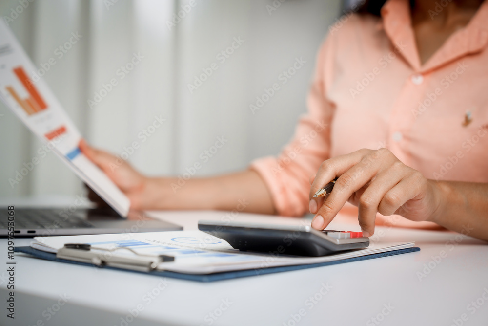 A close-up of a businesswoman working on a laptop in an office. As an accountant, she records financial data, verifies documents, manages income and expenses, ensuring accurate financial reporting A close-up of a businesswoman working on a laptop in an office. As an accountant, she records financial data, verifies documents, manages income and expenses, ensuring accurate financial reporting