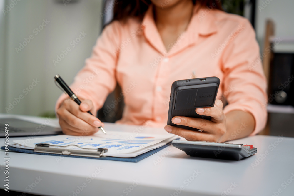 A close-up of a businesswoman working on a laptop in an office. As an accountant, she records financial data, verifies documents, manages income and expenses, ensuring accurate financial reporting A close-up of a businesswoman working on a laptop in an office. As an accountant, she records financial data, verifies documents, manages income and expenses, ensuring accurate financial reporting