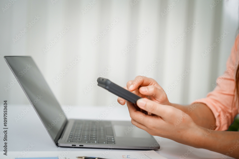 A close-up of a businesswoman working on a laptop in an office. As an accountant, she records financial data, verifies documents, manages income and expenses, ensuring accurate financial reporting A close-up of a businesswoman working on a laptop in an office. As an accountant, she records financial data, verifies documents, manages income and expenses, ensuring accurate financial reporting