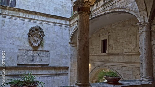 The Renaissance-style internal courtyard, with 3 orders of loggias supported by elegant travertine columns, of Palazzo dei Capitani del Popolo