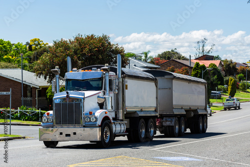 truck on road hauling dirt to construction site in Singleton photo