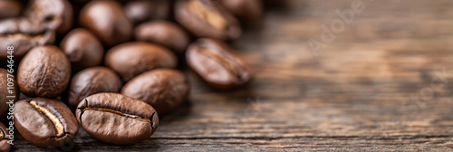 A close-up shot of rich, aromatic coffee beans scattered on a textured wooden table surface, highlighting their glossy, roasted finish and inviting aroma.