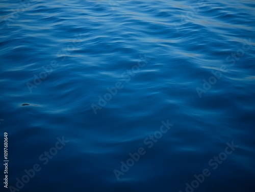 abstract background of dark blue water surface close up