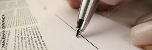 Businesswoman prepares to sign contract showing agreement