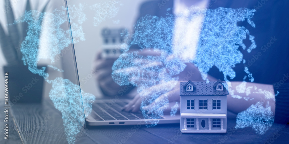 Fototapeta premium Business meeting using laptop and house model: concept of real estate investment and modern technologies in work