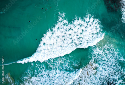 Surfers allow underdeveloped waves to pass.