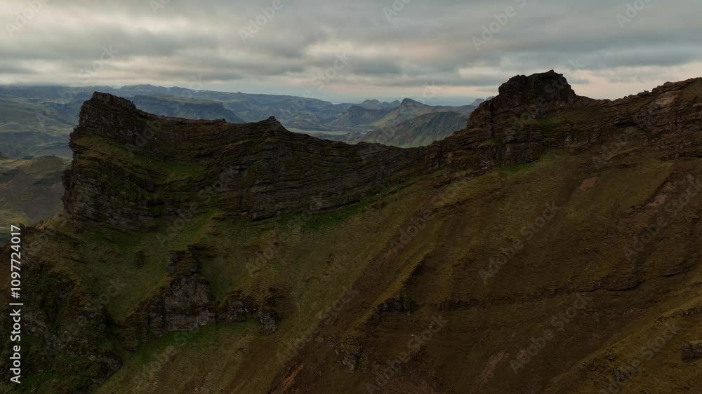 Breathtaking aerial view of Icelandic highlands near Hafursey, featuring rugged cliffs, a serene lake, and expansive volcanic terrain. Breathtaking aerial view of Icelandic highlands near Hafursey, featuring rugged cliffs, a serene lake, and expansive volcanic terrain.