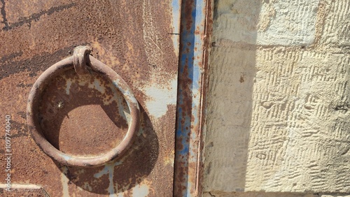 old metal door with a round handle