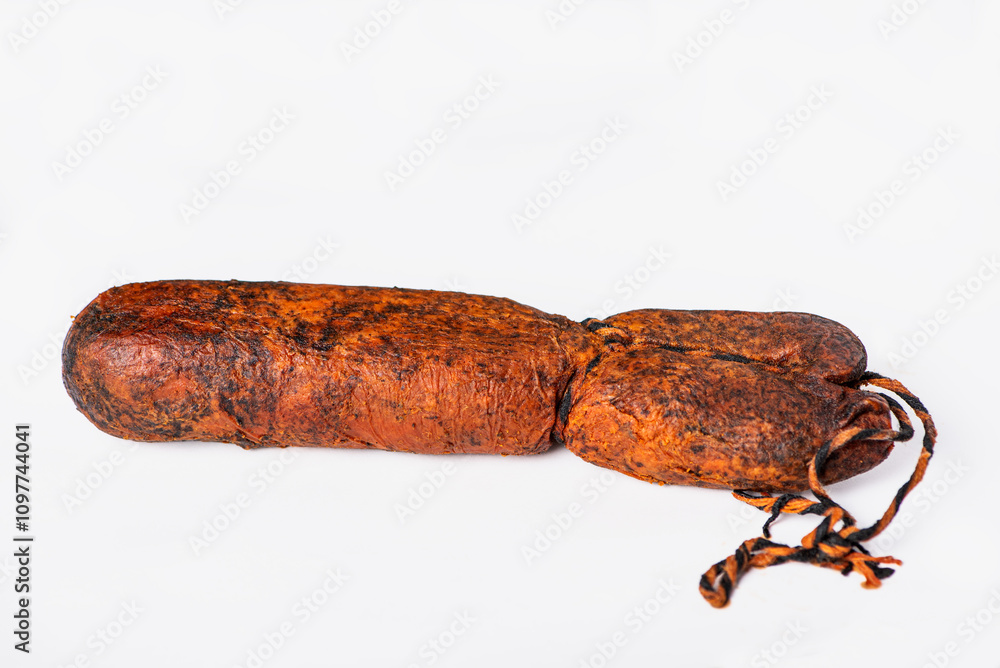 Sobrasada tripe, made from pork, salt, pepper and paprika, typical sausage from Mallorca, Balearic Islands, white background. Sobrasada tripe, made from pork, salt, pepper and paprika, typical sausage from Mallorca, Balearic Islands, white background.