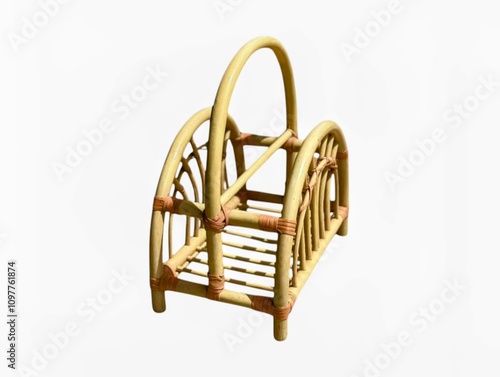 The white background in the picture is a brown wicker basket used to store books or notebooks. It is woven from wicker and has a natural and beautiful handle or handle. photo