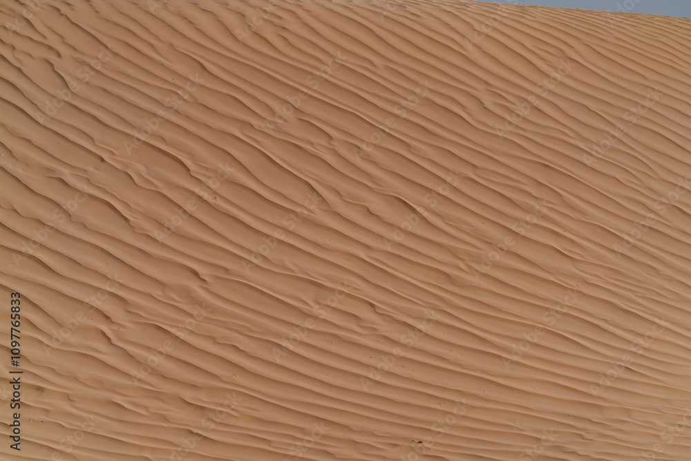 Natural texture formed by the wind on the surface of the sand Natural texture formed by the wind on the surface of the sand