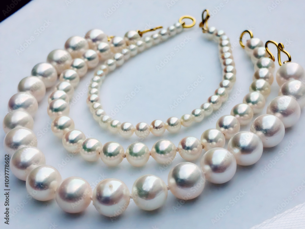 A Trio of Classic Designs and Elegant Pearl Bracelets. A Trio of Classic Designs and Elegant Pearl Bracelets.