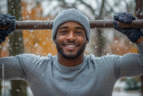 portrait of a smiling  black man in winter workout gear outdoors during snowfall, ideal for fitness promotions, winter apparel ads, or active lifestyle campaigns photo