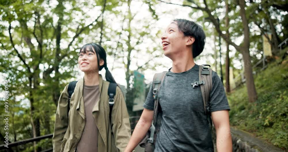 Adventure, laughing and couple in forest, backpacking and bonding in nature, romance and trip for anniversary. Smile, exploring and Japanese people in woods, outdoor and happy on vacation and Japan Adventure, laughing and couple in forest, backpacking and bonding in nature, romance and trip for anniversary. Smile, exploring and Japanese people in woods, outdoor and happy on vacation and Japan