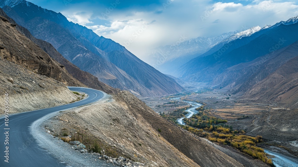 Obraz premium Road winding through a mountainous area, capturing the thrill of an adventure drive