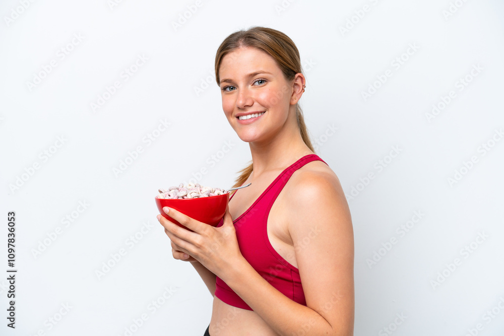 Young pretty blonde woman having breakfast milk isolated on white background smiling a lot Young pretty blonde woman having breakfast milk isolated on white background smiling a lot