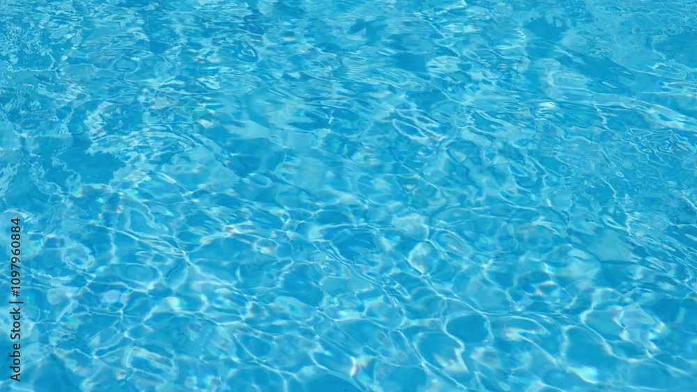 Blue Water Pool Surface with Sunlight Reflections Blue Water Pool Surface with Sunlight Reflections