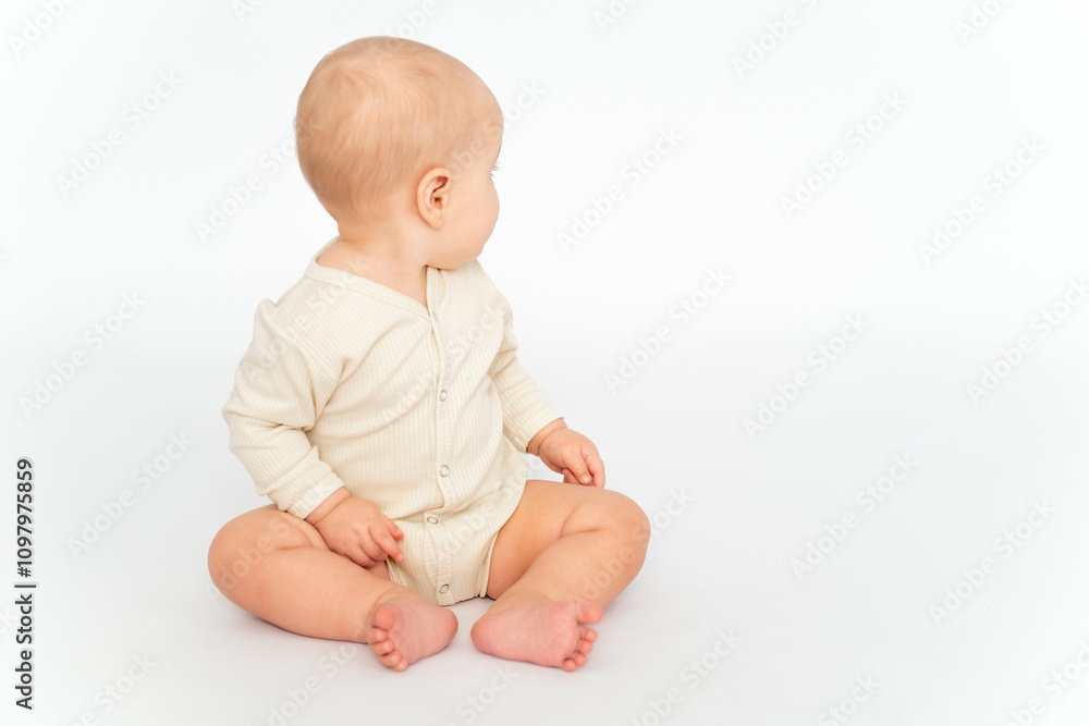 a baby on a white isolated background, a small child, a girl in light clothes looking back, a place and space for text and advertising a baby on a white isolated background, a small child, a girl in light clothes looking back, a place and space for text and advertising