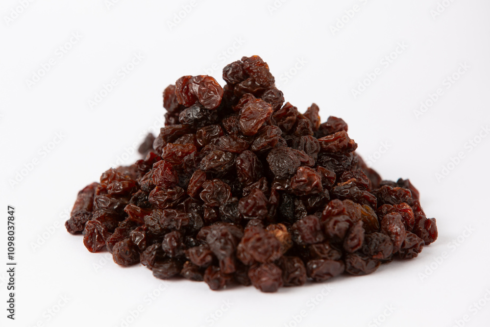 Fototapeta premium Pile of Dark Raisins on White Background