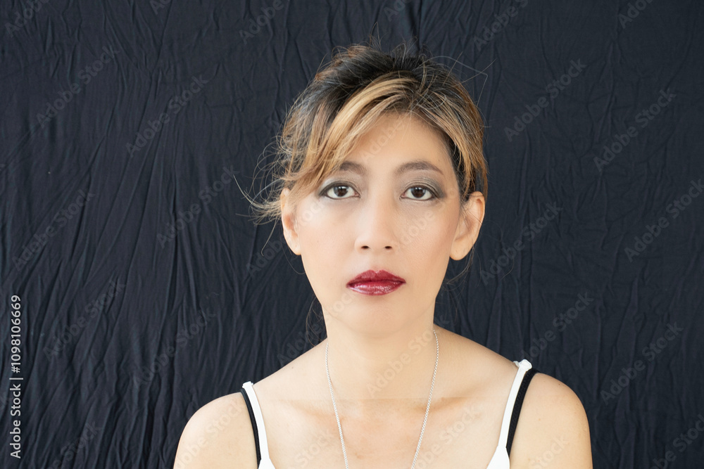 Portrait of face asian woman on black cloth background.