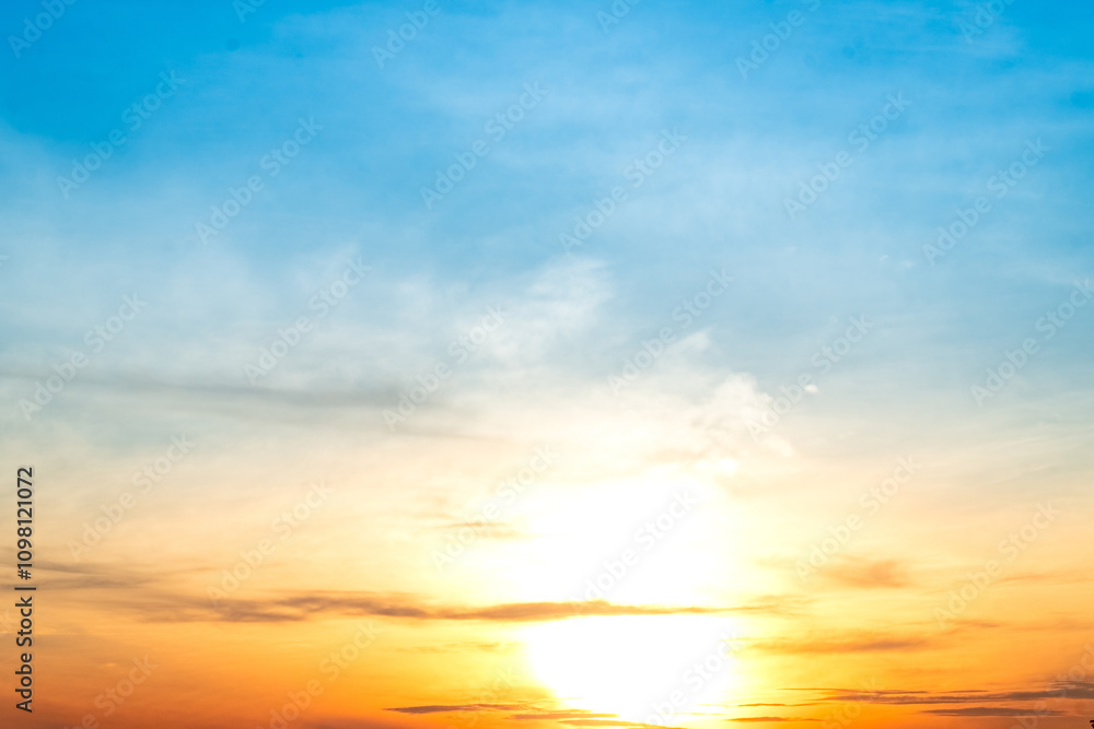 Fototapeta premium Beautiful , luxury soft gradient orange gold clouds and sunlight on the blue sky perfect for the background, take in everning,Twilight, Large size, high definition landscape photo