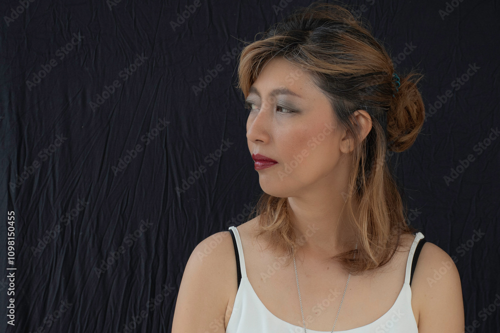 Portrait of face asian woman on black cloth background.