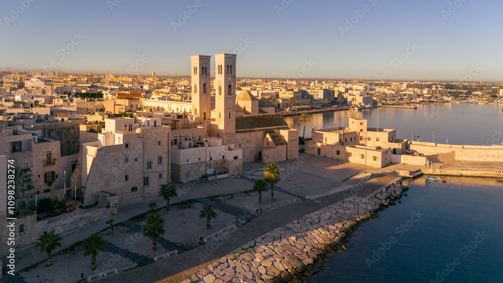 Fototapeta premium Aerial view old Mediterranean coastal city with big cathedral on sunny day, Molfetta, Puglia, Italy